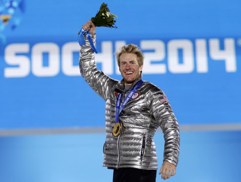 Men's giant slalom gold medalist Ted Ligety of the United States waves during the medals ceremony at the 2014 Winter Olympics, Thursday, Feb. 20, 2014, in Sochi, Russia. (AP Photo/David Goldman)