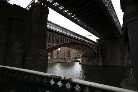 Trainlines run over a canal in central Manchester, northern England, April 12, 2015. REUTERS/Andrew Yates