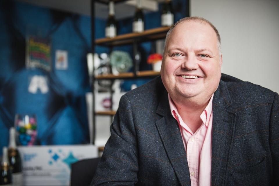 A photo portrait of a smiling Andy Carter, a Winners' Advisor at UK lottery agency Camelot.