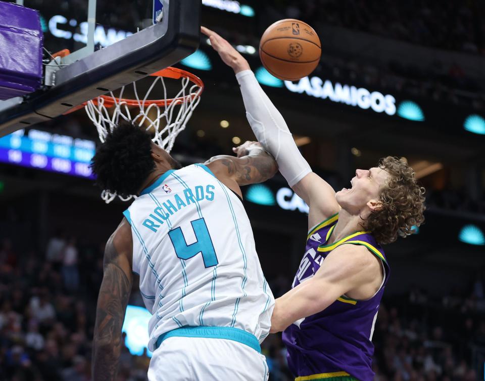 Utah Jazz forward Lauri Markkanen (23) is fouled by Charlotte Hornets center Nick Richards (4) in Salt Lake City on Thursday, Feb. 22, 2024. The Hornets won 115-107. | Jeffrey D. Allred, Deseret News