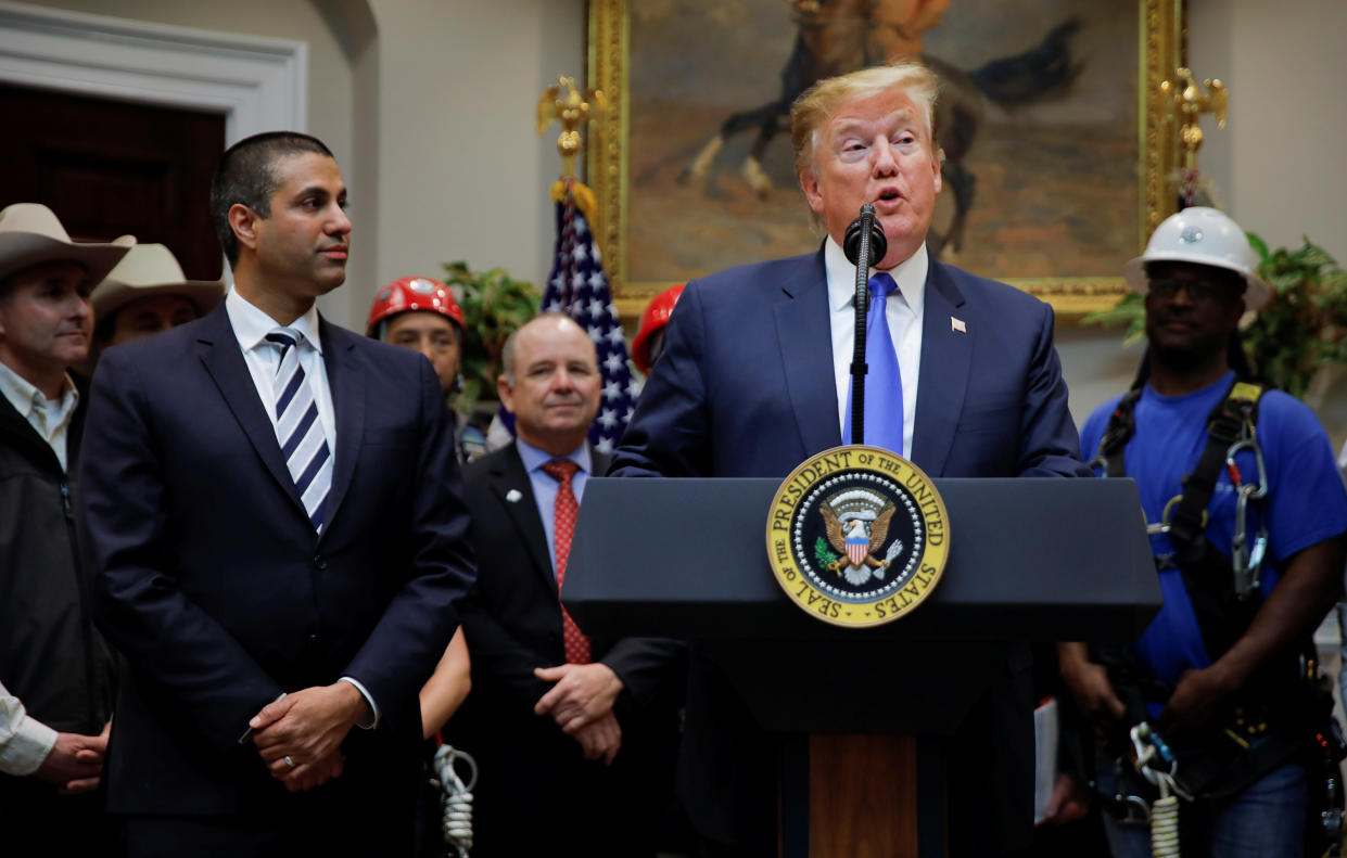 President Trump and FCC Chairman Ajit Pai at an event on United States 5G deployment on April 12. (Photo: Carlos Barria/Reuters)