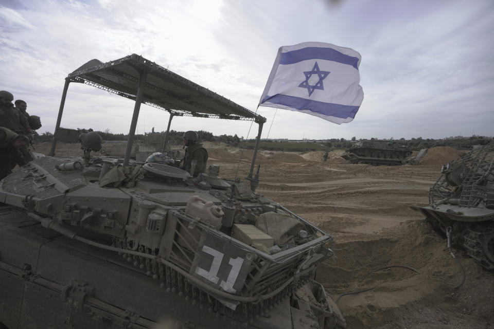 Israeli soldiers are seen during a ground operation in the Gaza Strip, Wednesday, Nov. 22, 2023. (AP Photo/Victor R. Caivano)