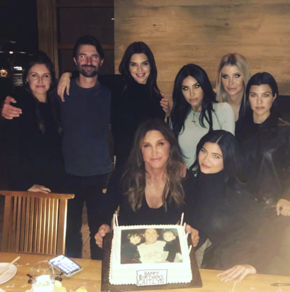 A photo of Caitlyn Jenner, Sophie Hutchins, Kendall Jenner, Kylie Jenner, Kim Kardashian and Kourtney Kardashian at a restaurant to celebrate Caitlyn's 70th birthday.