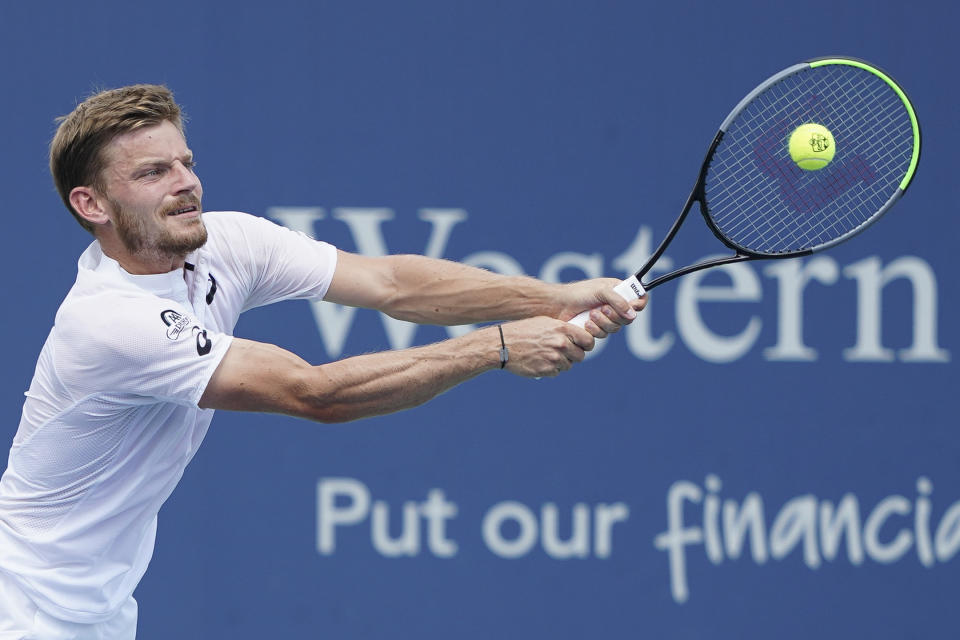 David Goffin, of Belgium, returns to Richard Gasquet, of France, during the Western & Southern Open tennis tournament, Saturday, Aug. 17, 2019, in Mason, Ohio. (AP Photo/John Minchillo)