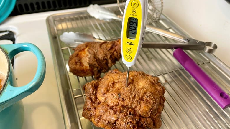 checking internal temperature of chicken