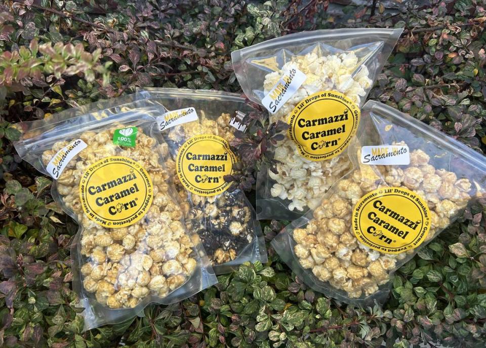 Service journalism reporter Brianna Taylor visits Carmazzi Caramel Corn at 520 La Sierra Drive, Sacramento, on Monday, Oct. 23, 2023, with $25. She spent all of her budget on various flavors of caramel corn.