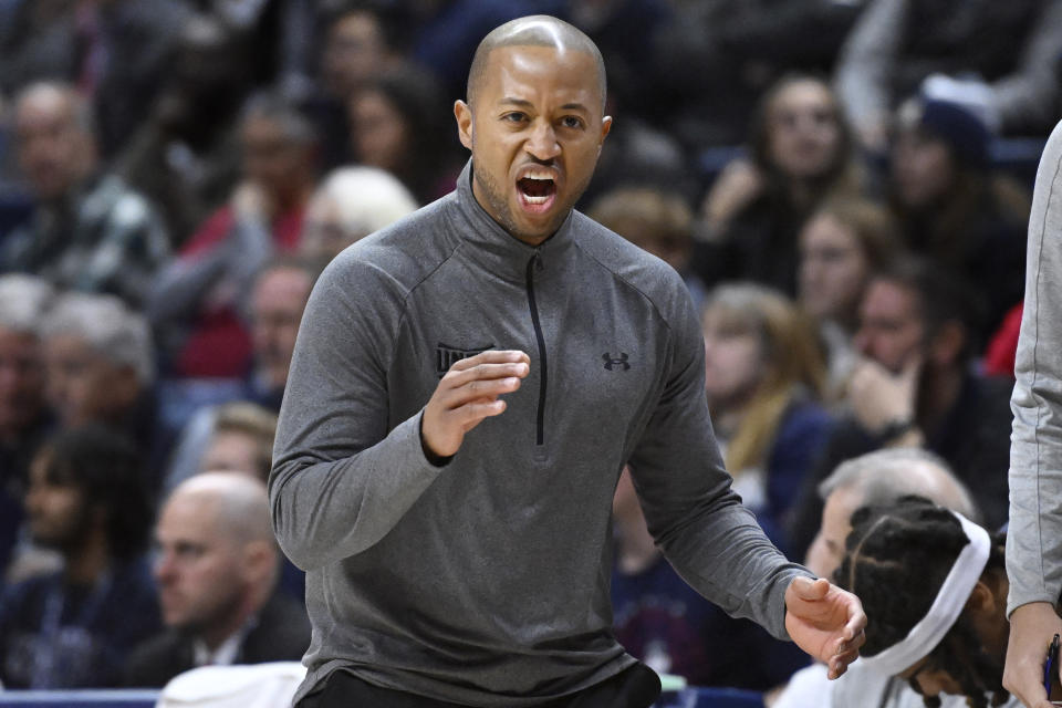 UNC Wilmington coach Takayo Siddle reacts during the first half of the team's NCAA college basketball game against Connecticut, Friday, Nov. 18, 2022, in Storrs, Conn. (AP Photo/Jessica Hill)