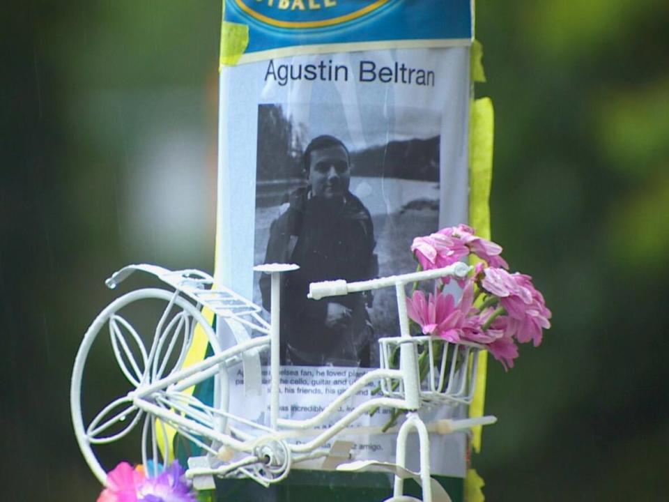 A memorial to cyclist Agustín Beltrán, 28, is seen at the site where he was killed in collision with a dump truck in Vancouver's West End on Wednesday.  (CBC News - image credit)