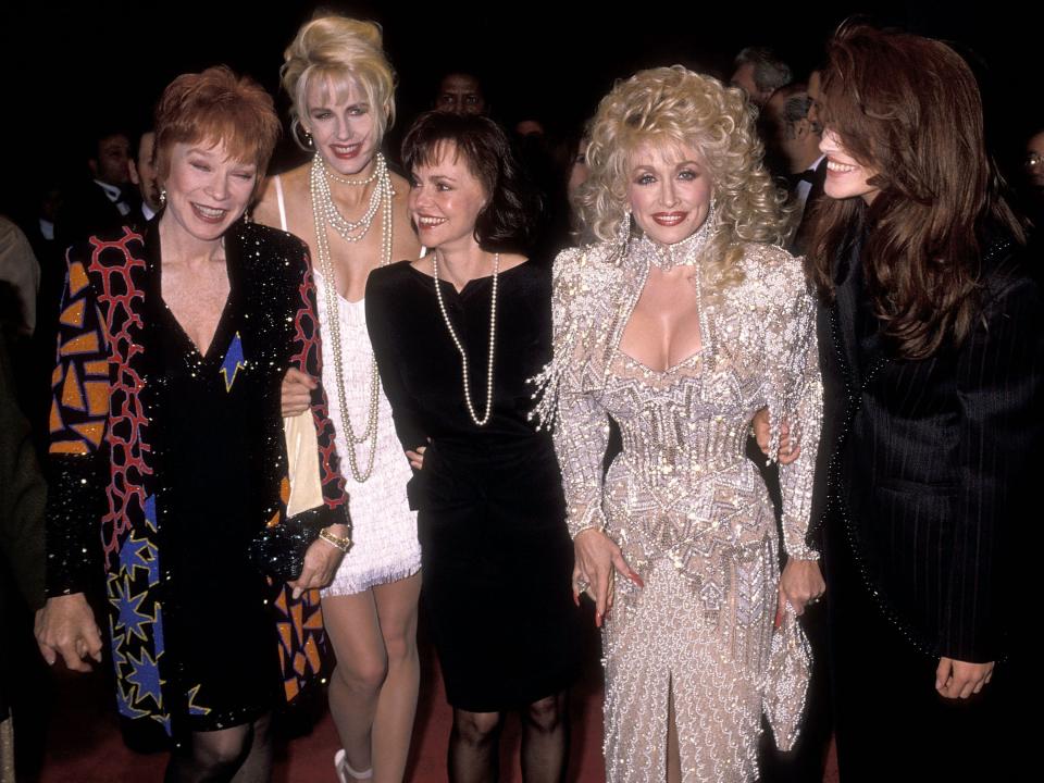 Shirley MacLaine, Daryl Hannah, Sally Field, Dolly Parton in a silver fully beaded gown and Julia Roberts.