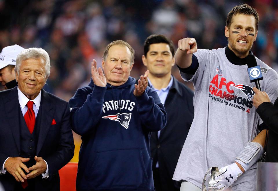 New England Patriots QB Tom Brady points to teammates as head coach Bill Belichick and owner Robert Kraft look on after the 2017 AFC Championship Game.