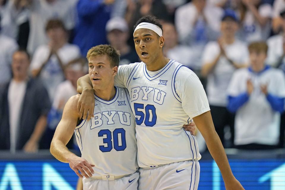 BYU center Aly Khalifa (50) hugs Dallin Hall after scoring against Evansville Dec. 5, 2023, in Provo, Utah. | Rick Bowmer, Associated Press