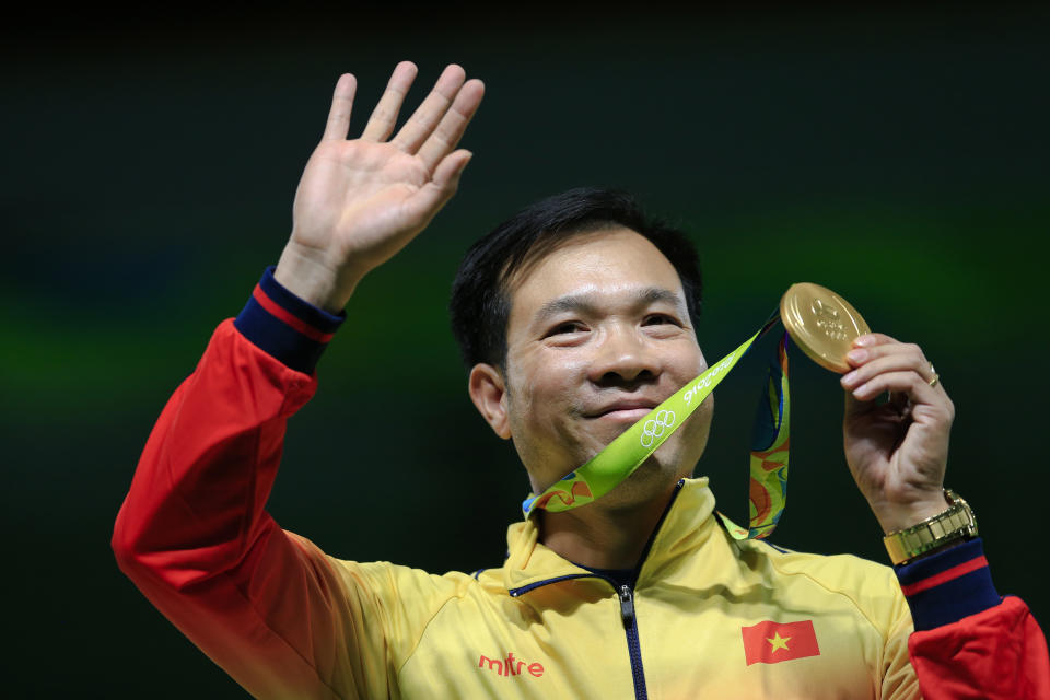 Hoang Xuan Vinh of Vietnem displays his gold medal following the victory ceremony for the men's 10-meter air pistol event at Olympic Shooting Center at the 2016 Summer Olympics in Rio de Janeiro, Brazil, Saturday, Aug. 6, 2016. (AP Photo/Hassan Ammar)