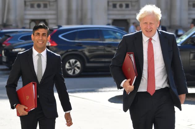 Boris Johnson and Rishi Sunak arrive to attend a cabinet meeting of senior government ministers at the Foreign and Commonwealth Office.