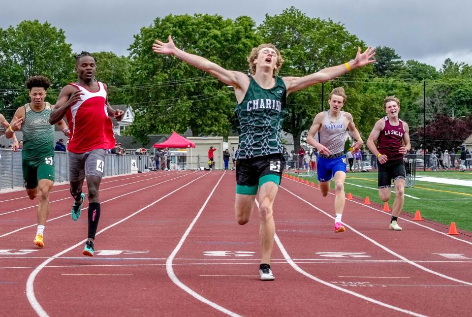 Chariho's Elias Sposato celebrates his win in the 400 in 2023.