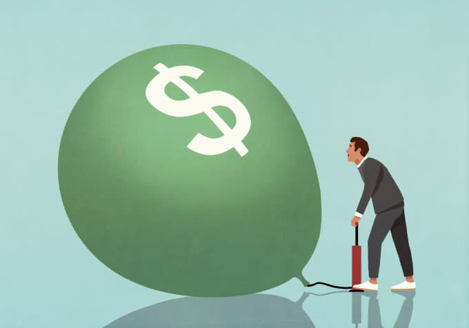 Image of a businessman blowing up a green balloon with a dollar sign on it to represent investment.