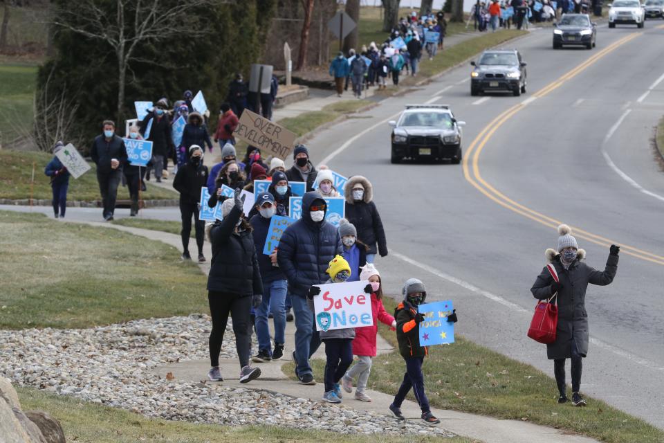 A group of over 100 protesters marched up Southern Blvd. to express their objection to the development of Noe Pond Club. The club has been sold to a developer causing club members and local residents to hold a rally against the development of the property.