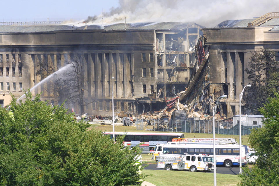 <p>Alex Wong/Getty Images</p><p>Smoke comes out from the Southwest E-ring of the Pentagon building after a plane crashed into the building and set off a huge explosion. </p>