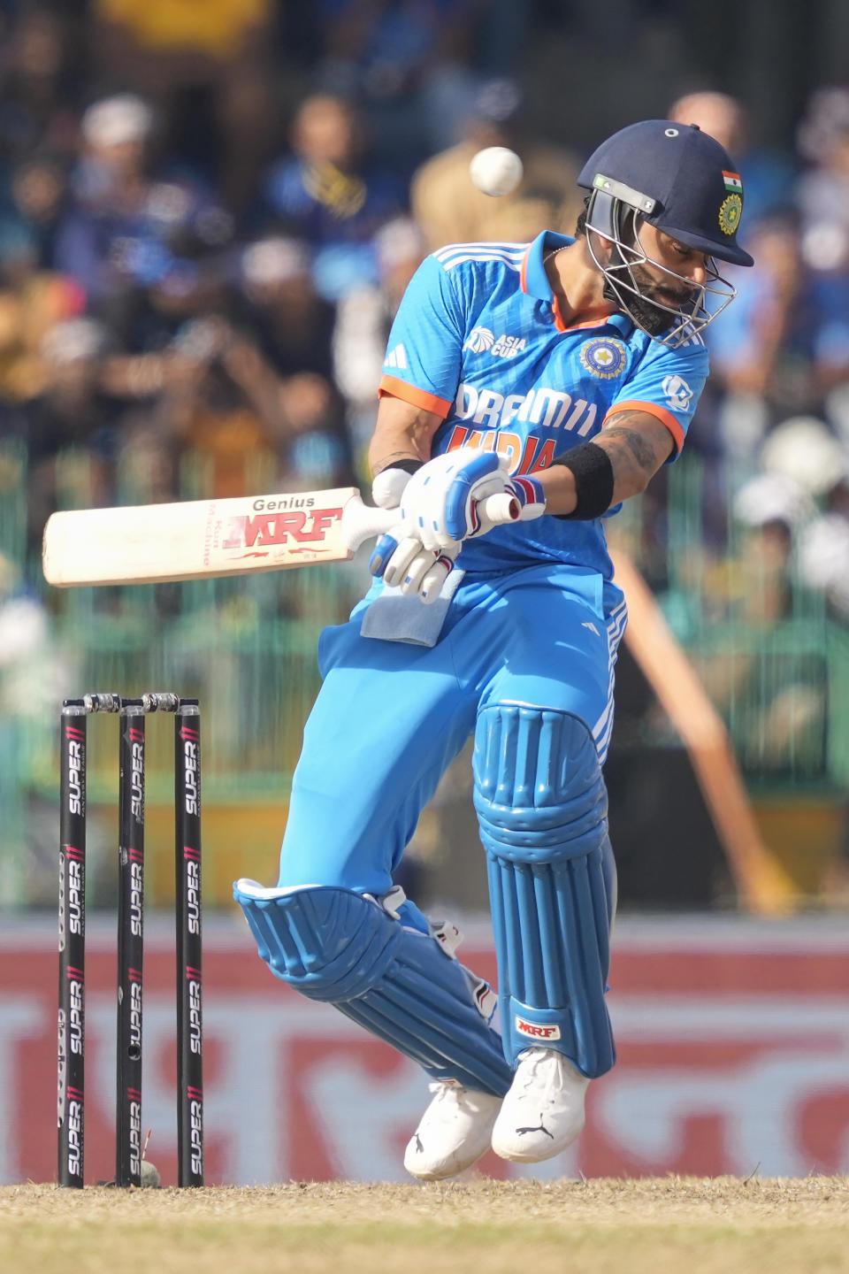 India's Virat Kohli avoids a rising delivery during the Asia Cup cricket match between Sri Lanka and India in Colombo, Sri Lanka, Tuesday, Sept. 12, 2023. (AP Photo/Eranga Jayawardena)