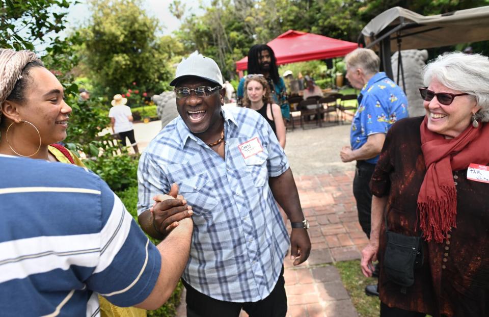 Gary Tyler chats with friends during a July reunion party in Santa Monica.