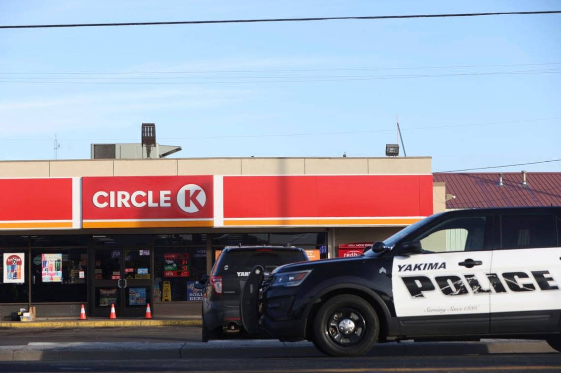 Police cordon off the area around a Circle K convenience store on Nob Hill Boulevard in Yakima, Wash., on Tuesday, Jan. 24, where people were fatally shot in the early morning.