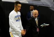 June 19, 2016; Oakland, CA, USA; Golden State Warriors guard Stephen Curry (30) leaves the press conference with vice president of communications Raymond Ridder following the 93-89 loss against the Cleveland Cavaliers iin game seven of the NBA Finals at Oracle Arena. Mandatory Credit: Cary Edmondson-USA TODAY Sports