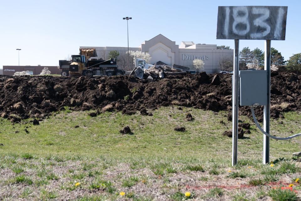 Concrete is removed from the property at 1731 S.W. Wanamaker Road, on Monday afternoon.