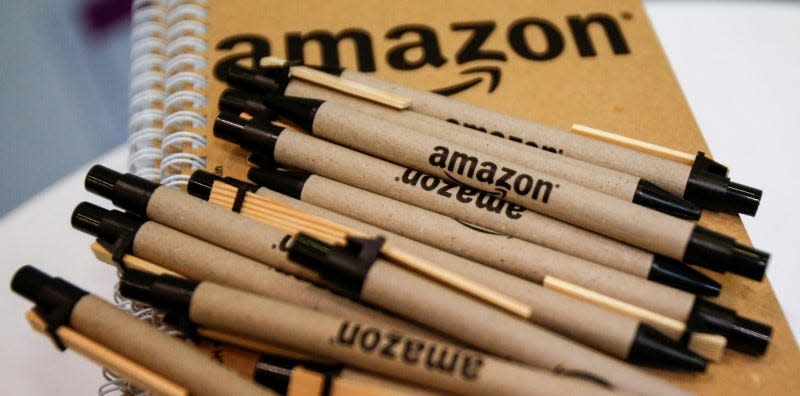 Pens and paper with the Amazon logo are seen at the logistics center in Brieselang, Germany November 17, 2015. REUTERS/Hannibal Hanschke  