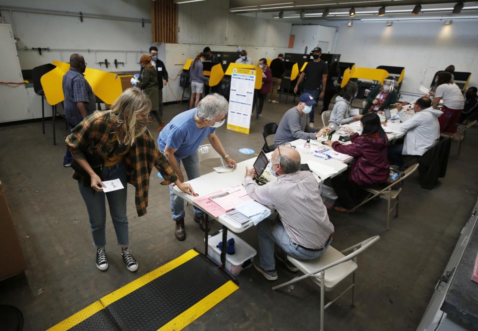 Voters check in with poll workers