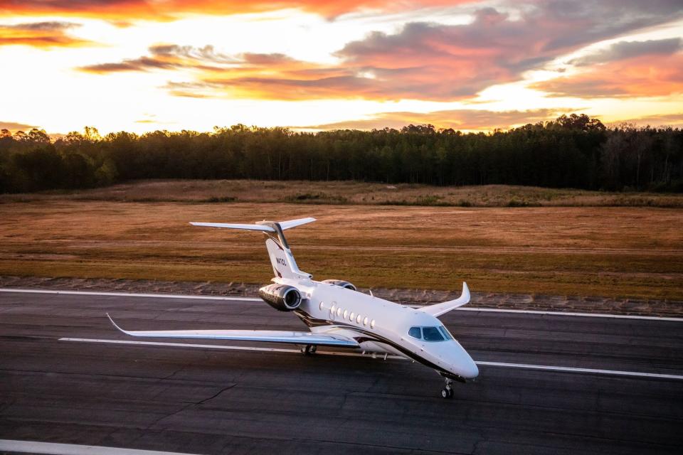 A CJ4+ aircraft on the runway.