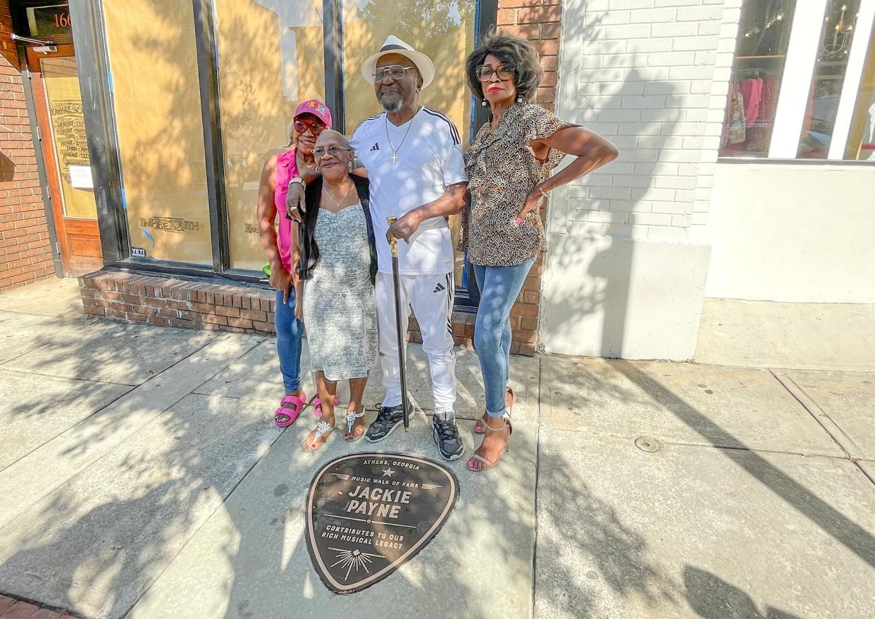 R&B artist Jackie Payne (center) and family celebrate his Athens Music Walk of Fame plaque in downtown Athens, Ga. on Wednesday, Oct. 4, 2023.
