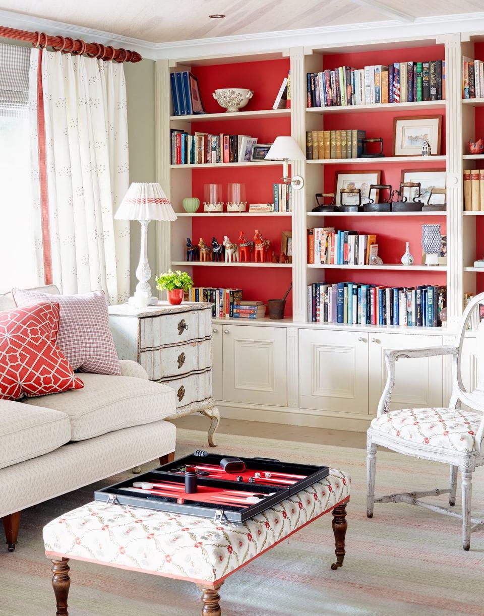 <p>If you love nothing more than making a statement, paint the back of your bookcases in a daring shade to show off your every-growing collection. </p>