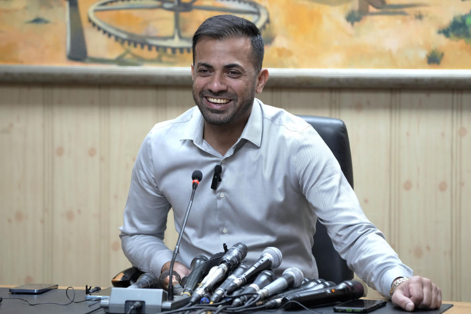 Pakistan fast bowler Wahab Riaz smiles during a press conference, in Lahore, Pakistan, Wednesday, Aug. 16, 2023. Riaz retired from international cricket on Wednesday but will continue to play franchise cricket. (AP Photo/K.M. Chaudary)