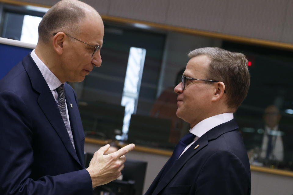 Author of the High-Level Report on the future of the Single Market Enrico Letta, left, speaks with Finland's Prime Minister Petteri Orpo during a round table meeting at an EU summit in Brussels, Thursday, April 18, 2024. European Union leaders vowed on Wednesday to ramp up sanctions against Iran as concern grows that Tehran's unprecedented attack on Israel could fuel a wider war in the Middle East. (AP Photo/Omar Havana)