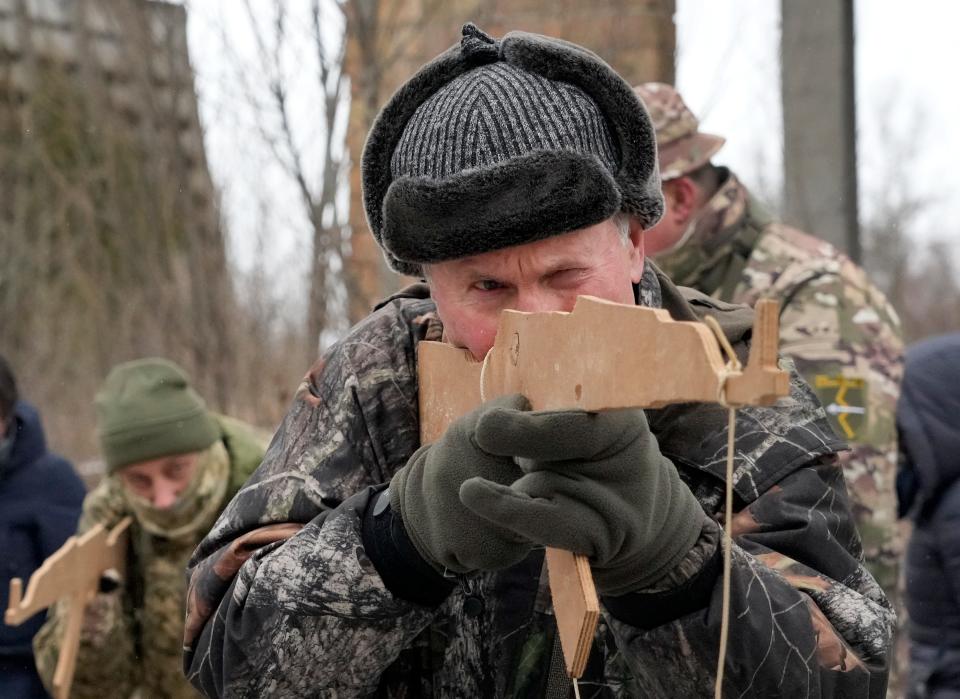 Members of Ukraine's Territorial Defense Forces, volunteer military units of the Armed Forces, train close to Kyiv, Ukraine, Saturday, Jan. 29, 2022.