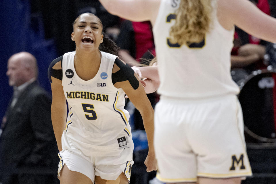 Michigan guard Laila Phelia (5) celebrates scoring against UNLV in the first half of a first-round college basketball game in the women's NCAA Tournament in Baton Rouge, La., Friday, March 17, 2023, (AP Photo/Matthew Hinton)