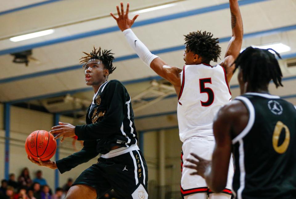 Ja'Kobe Walter of Link Academy, goes to the basket during a game against the Legacy (Texas) Broncos in the Ozark Mountain Shootout at Glendale High School on Thursday, Dec. 8, 2022.