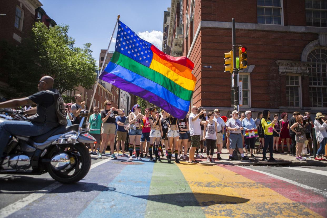 FILE - Participants of the 2016 Pride Parade march through downtown on June 12, 2016 in Philadelphia, Pennsylvania. 