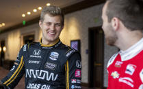 IndyCar driver Marcus Ericsson, of Sweden, speaks with fellow driver Ed Jones during IndyCar auto racing media day, Monday, Feb. 11, 2019, in Austin, Texas. (AP Photo/Stephen Spillman)