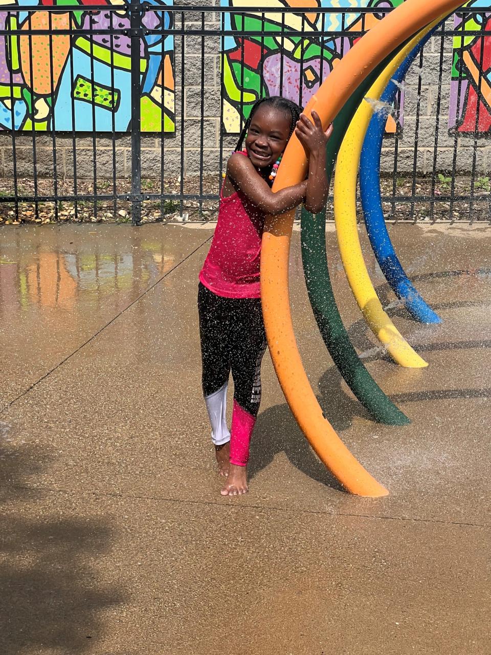 Eri'onna Waters enjoys Kirkpatrick Park's splash pad during a hot summer stretch in Nashville.