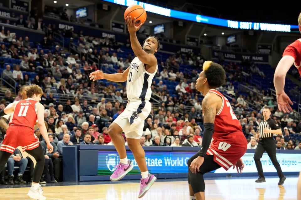 Penn State guard Kanye Clary drives to basket past Wisconsin guard Chucky Hepburn on his way to 27 points Tuesday.