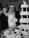 <p>French singer Charles Aznavour married his bride Ulla Thorsell in a lavish Las Vegas ceremony. Here, the couple—who stayed together until his passing in 2018—taste their wedding cake. </p>