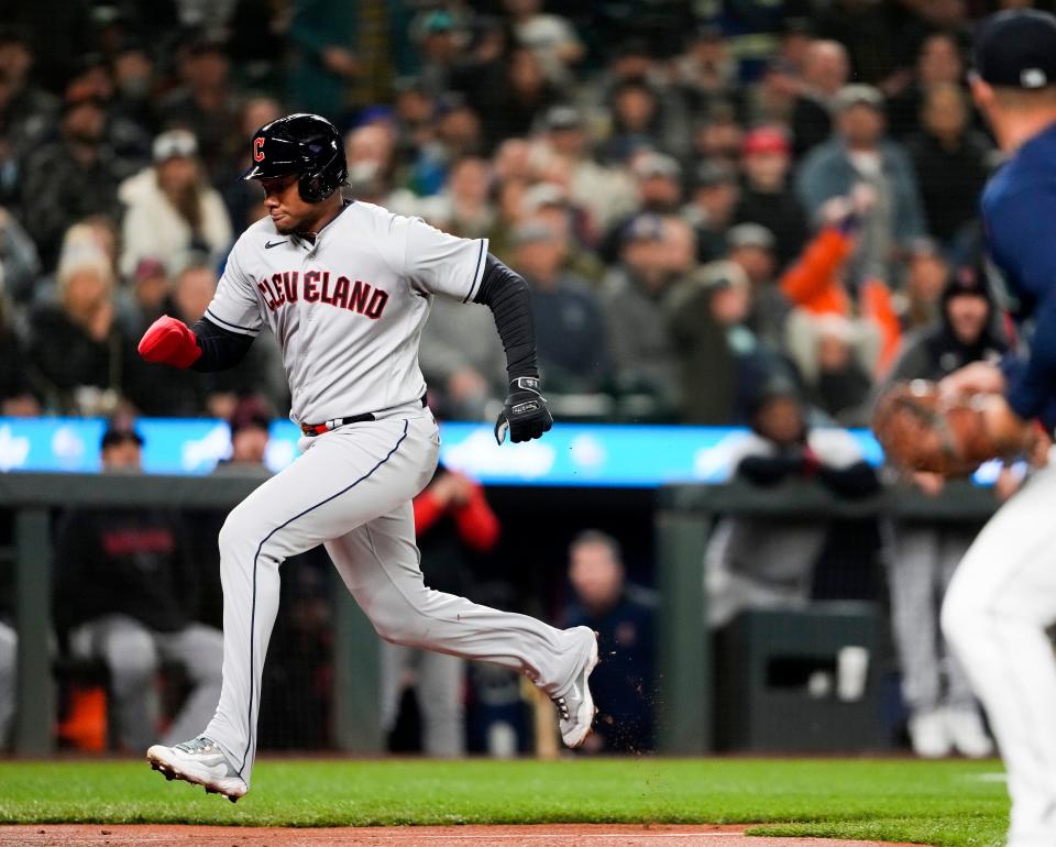 Cleveland Guardians' Oscar Gonzalez scores against the Seattle Mariners during the second inning of a baseball game Friday, March 31, 2023, in Seattle. (AP Photo/Lindsey Wasson)