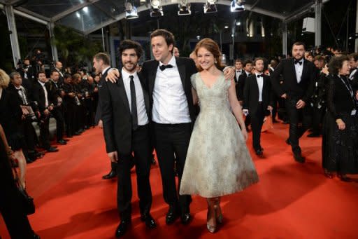 French actor Tahar Rahim (L), French actress Emilie Dequenne and Belgian director Joachim Lafosse arrive for the screening of "The Angel's Share" presented in competion at the 65th Cannes film festival