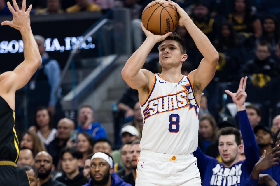 Phoenix Suns guard Grayson Allen (8) takes a three-point shot against the Golden State Warriors during the first half at Chase Center in San Francisco on Feb. 10, 2024.