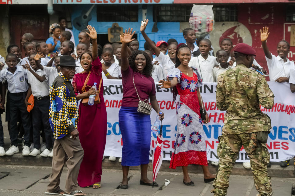 People cheer at Pope Francis as he arrives in Kinshasa, Democratic Republic of the Congo, Tuesday, Jan. 31, 2023 to start his six-day pastoral visit to Congo and South Sudan where he'll bring a message of peace to countries riven by poverty and conflict. (AP Photo/Gregorio Borgia)