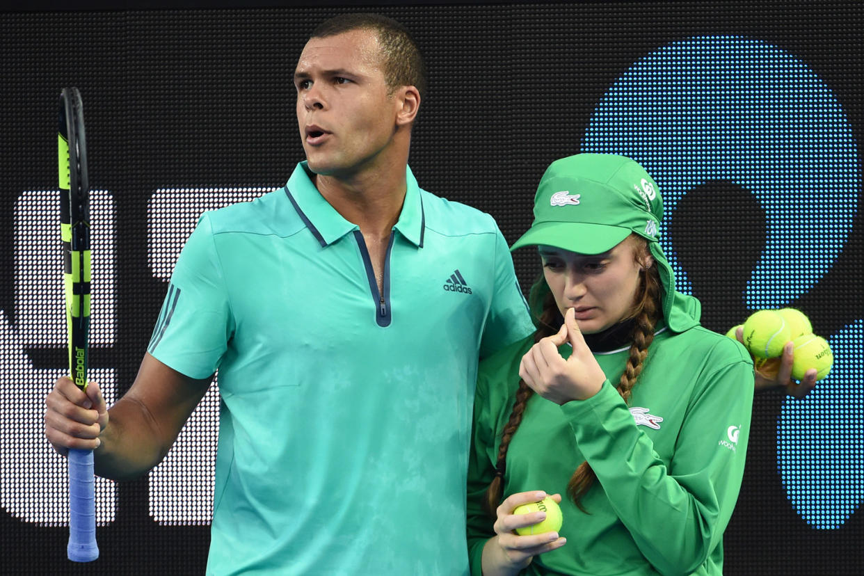 Crying: Tsonga halted play to help the ball girl who was in distress: AFP/Getty Images