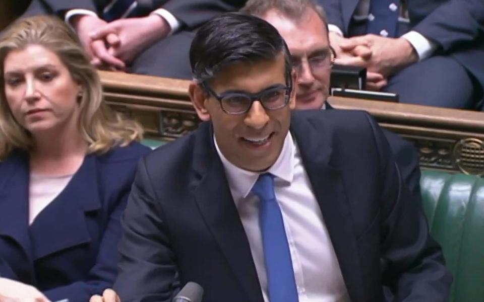 Rishi Sunak, the Prime Minister, addresses MPs in the House of Commons during PMQs - PA