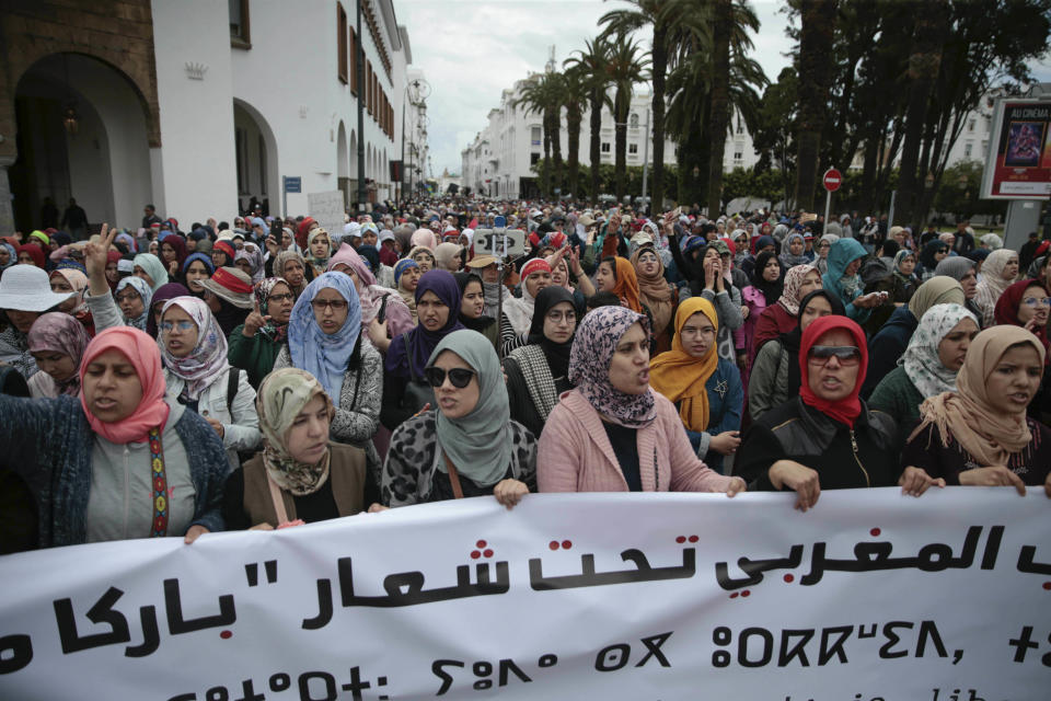 Thousands of Moroccans take part in a demonstration in Rabat, Morocco, Sunday, April 21, 2019. Protesters are condemning prison terms for the leader of the Hirak Rif protest movement against poverty and dozens of other activists. Banner in Arabic reads "Enough injustice, freedom to our nation". (AP Photo/Mosa'ab Elshamy)