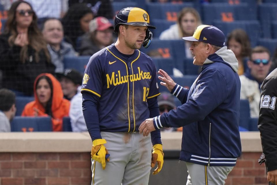 Milwaukee Brewers Manager Pat Murphy, right, talks to Rhys Hoskins after a close pitch by New York Mets relief pitcher Yohan Ramirez during the seventh inning of a baseball game Saturday, March 30, 2024, in New York. Ramirez was ejected from the game. (AP Photo/Frank Franklin II)