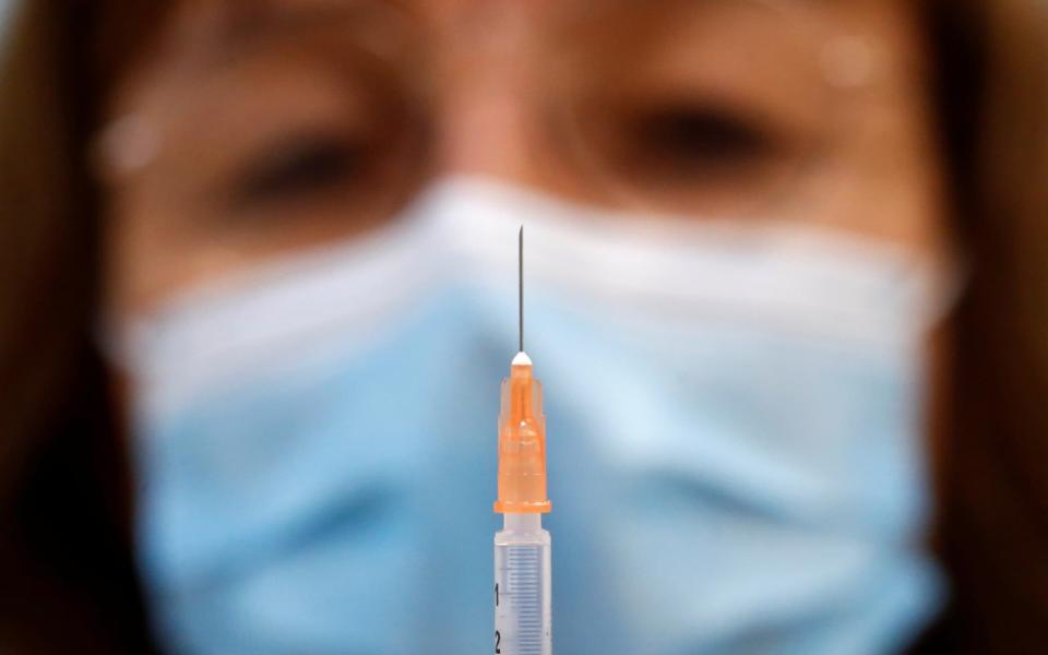 The vaccine is being rolled out among the vulnerable  - STEPHANE MAHE/REUTERS